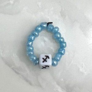 "SAGITTARIUS"  HOROSCOPE BEADED RING, ONE SIZE, LIGHT BLUE BEADS